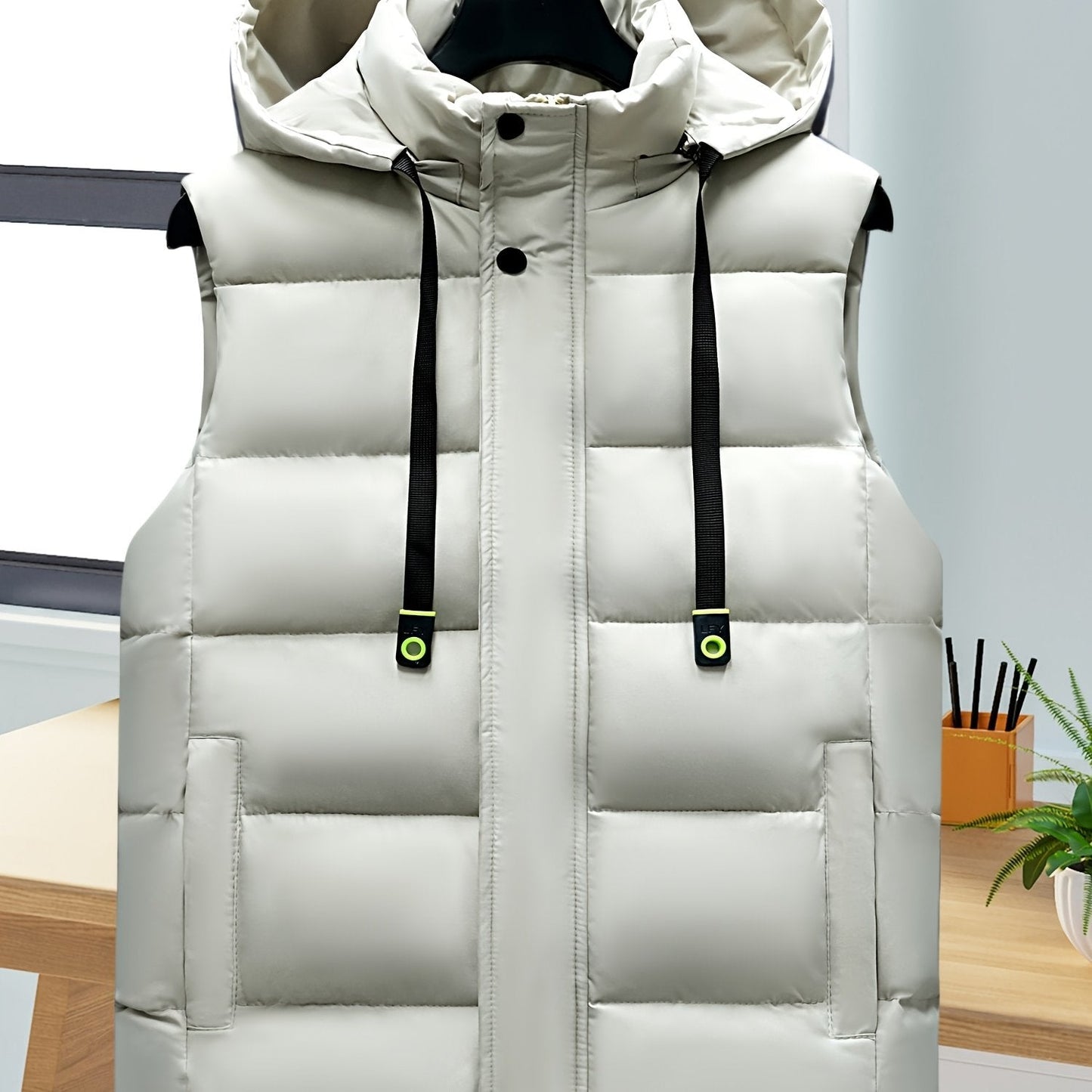 Unisex hooded quilted vest with a zipper and pockets