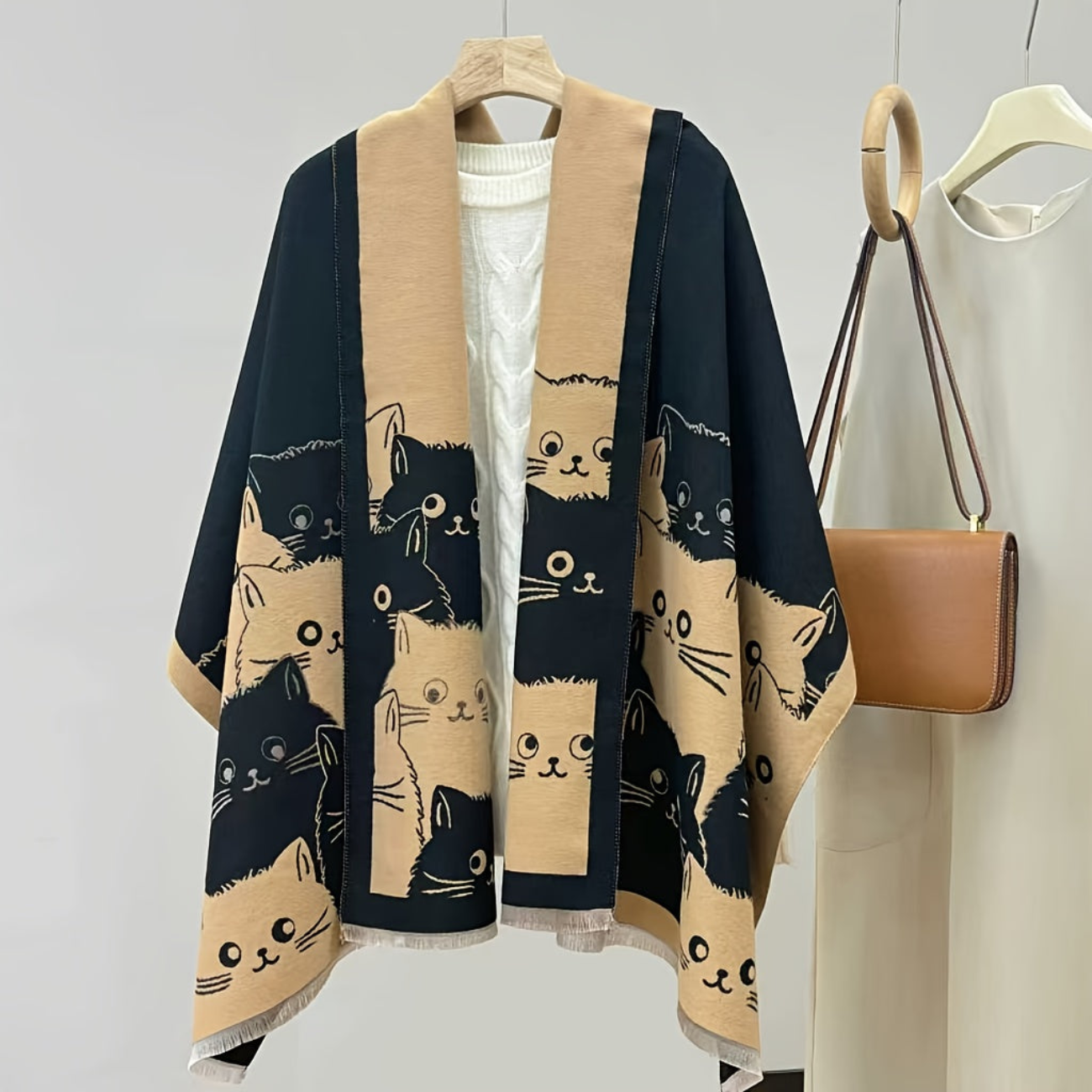 Women's poncho with cat pattern, fringe, and soft fabric