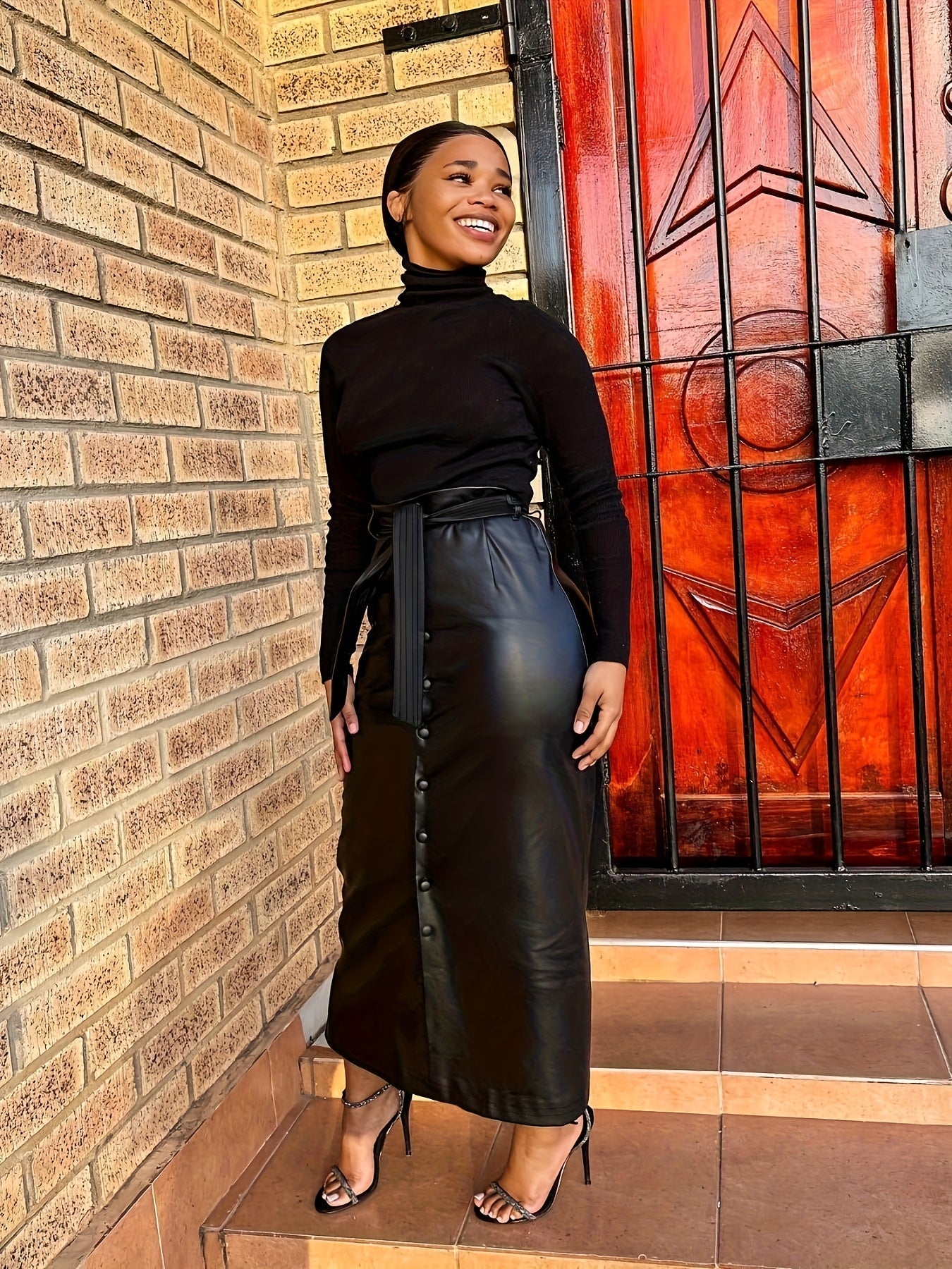 Women's faux leather maxi skirt with buttons and tie belt, black