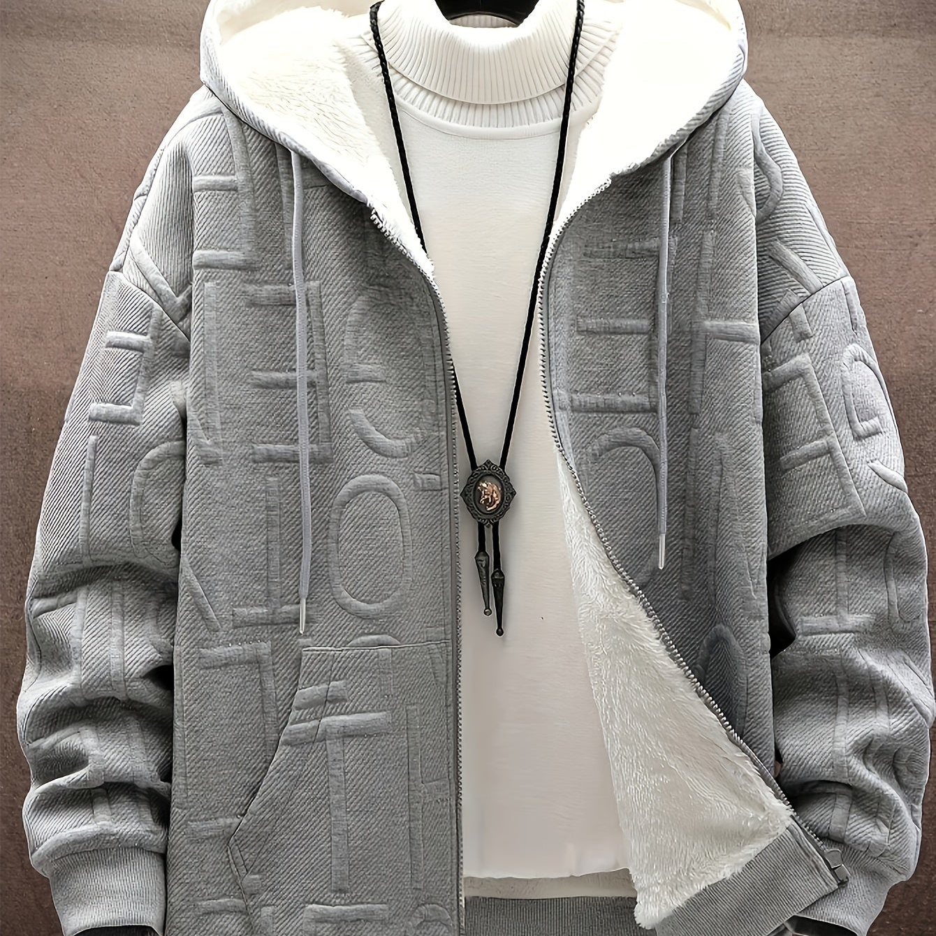 Unisex hooded jacket with fleece lining and raised lettering, zipper, kangaroo pockets, in black