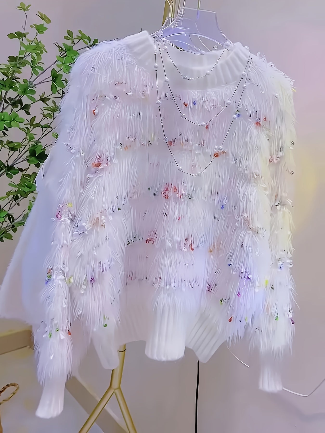 White fluffy pullover with colorful accents