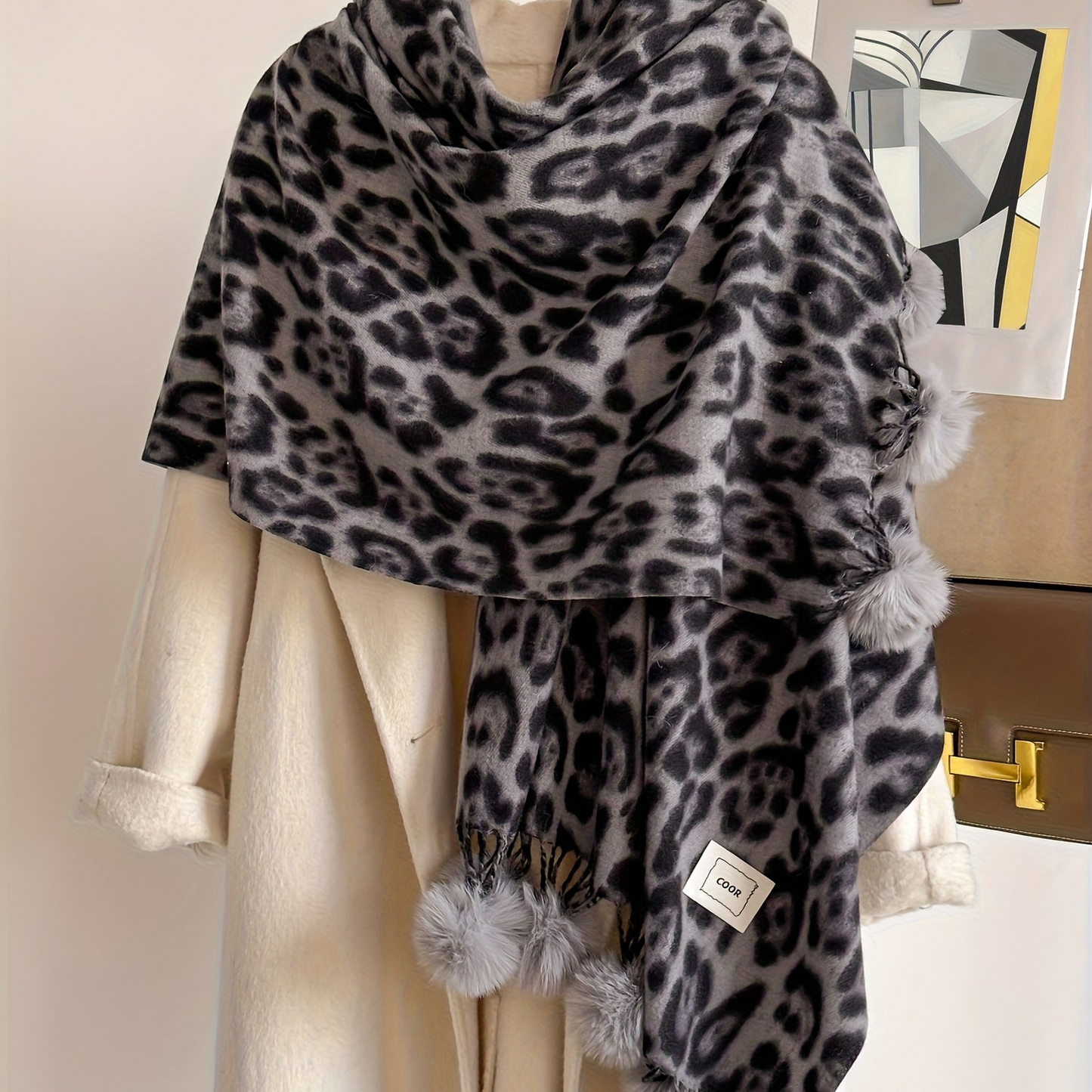 Leopard-print scarf with pom-poms