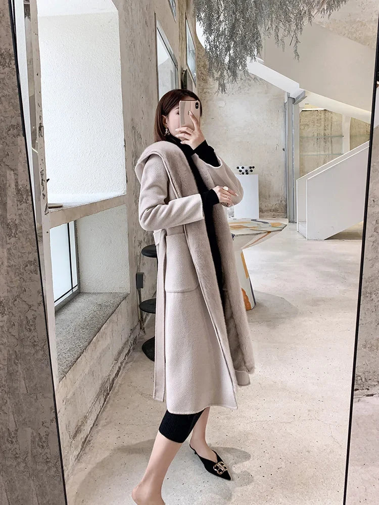 Women's winter coat with hood and fur look, long, black