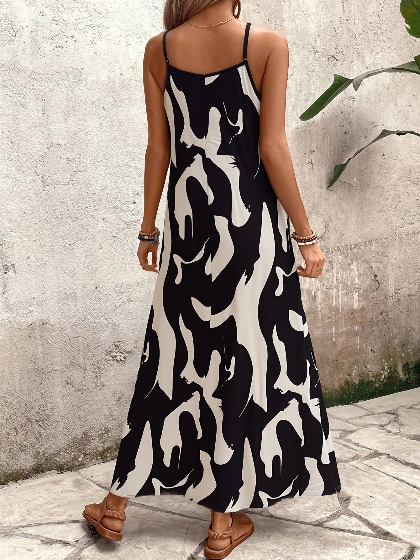 Women's sleeveless maxi dress with abstract pattern, summer boho style for casual wear and vacation