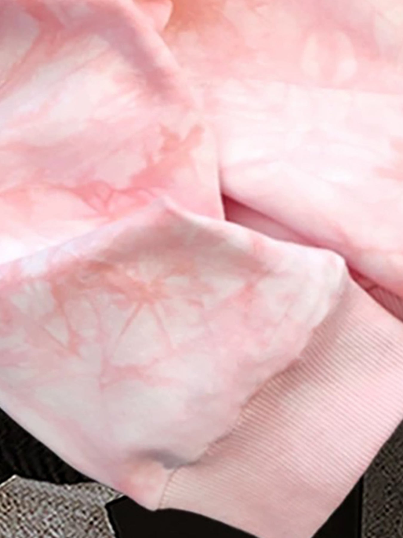 Pink tie-dye hoodie with spider print and hood