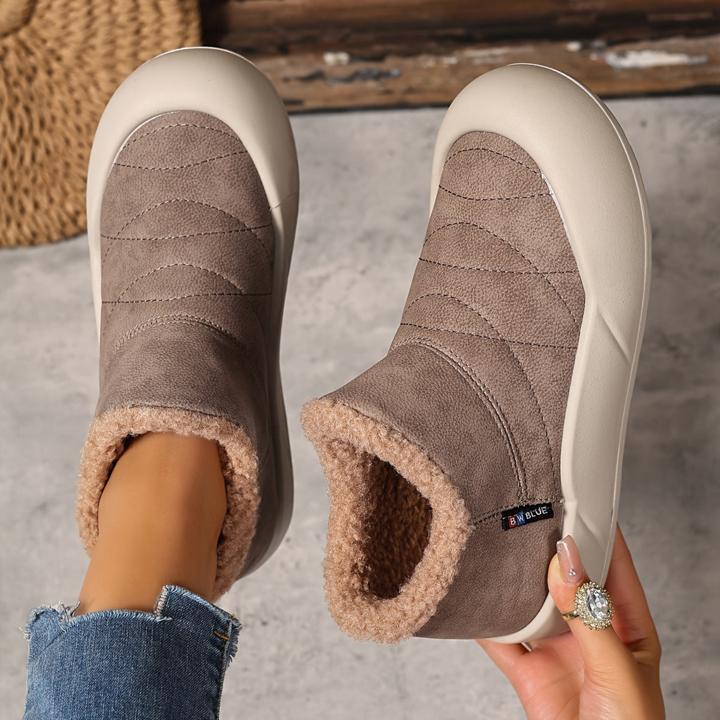 Lined gray ankle boots with quilted uppers and beige plush lining