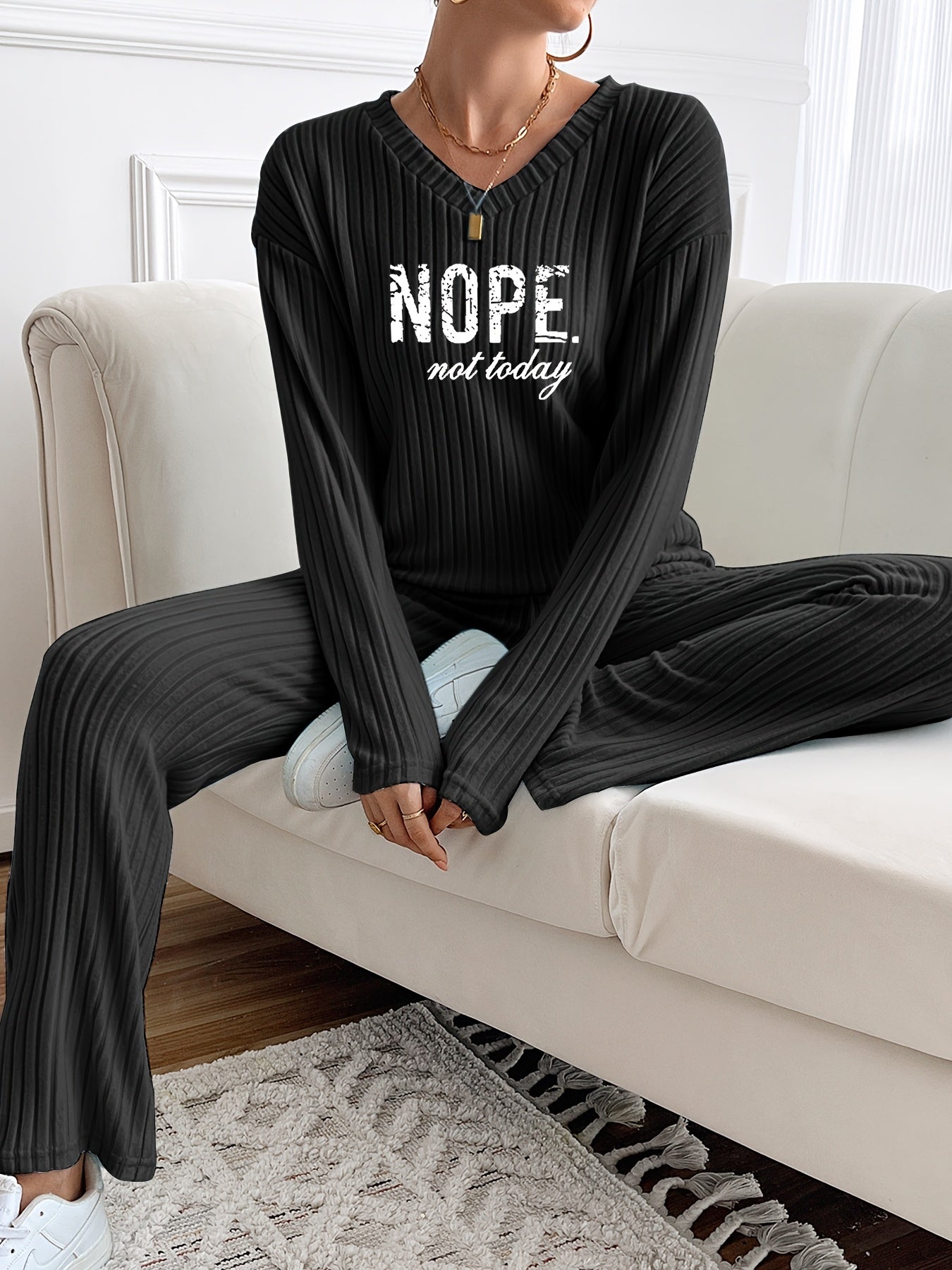 Ribbed women’s two-piece set with a V-neck top featuring lettering and wide-leg pants