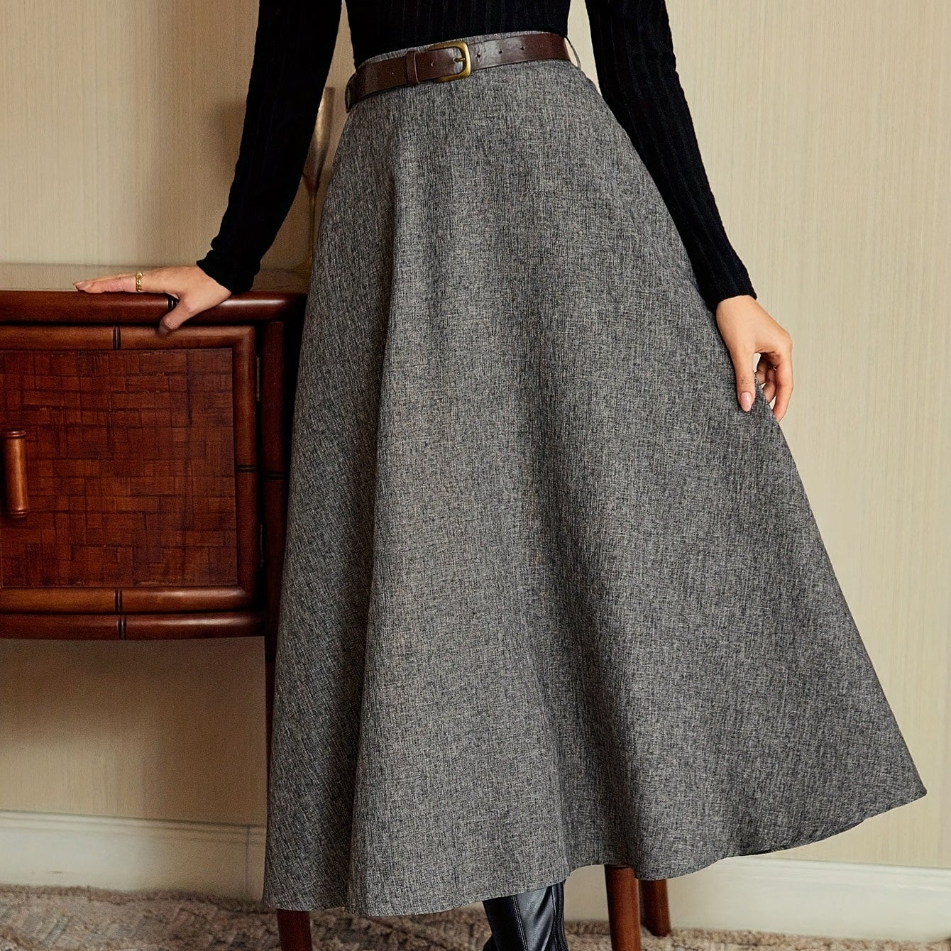 Women's gray A-line midi skirt with a flared hem