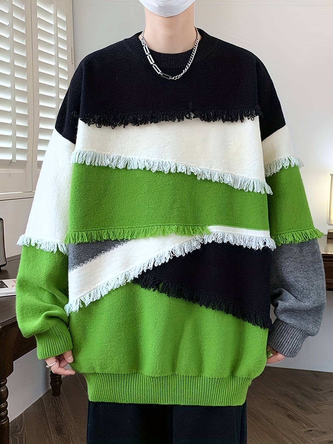 Unisex long-sleeve pullover with color-block design, fringe, and crew neck