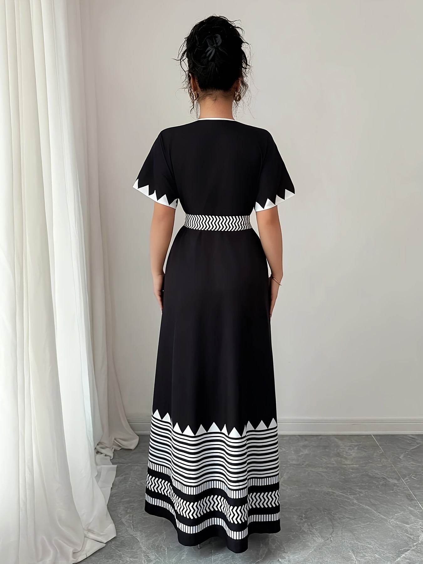 Women's maxi dress with graphic pattern and waist belt – Elegant summer dress for festive occasions