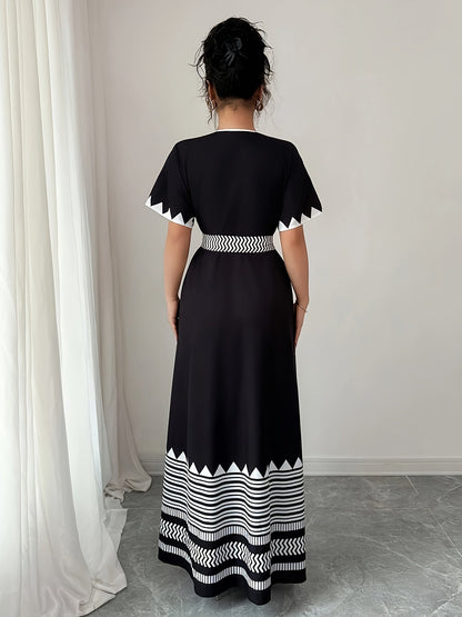 Women's maxi dress with graphic pattern and waist belt – Elegant summer dress for festive occasions