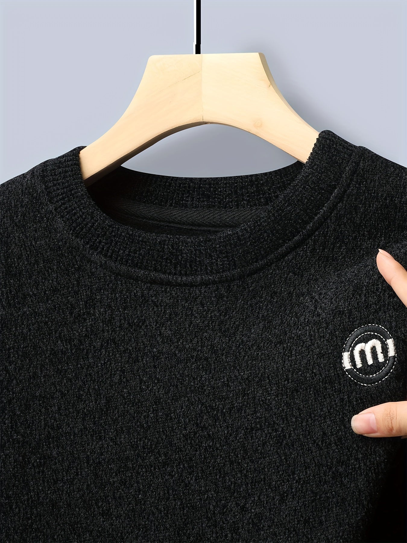 Unisex long-sleeve pullover with a crew neck and ribbed cuffs, lined