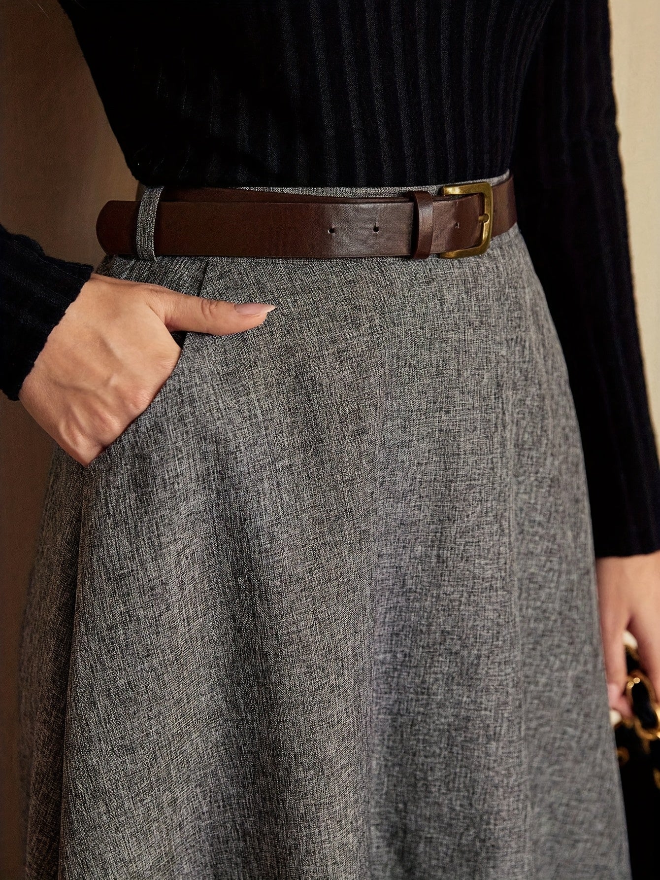 Women's gray A-line midi skirt with a flared hem