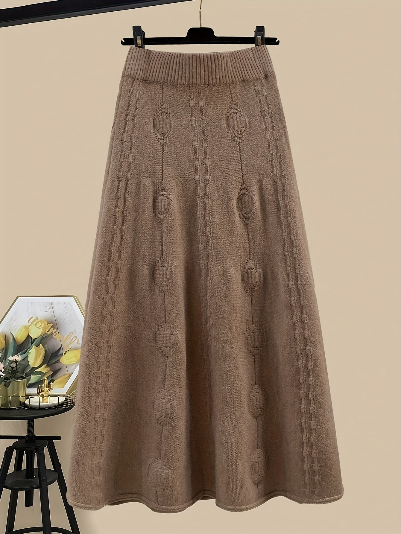 Women's knitted set with a turtleneck sweater and midi skirt