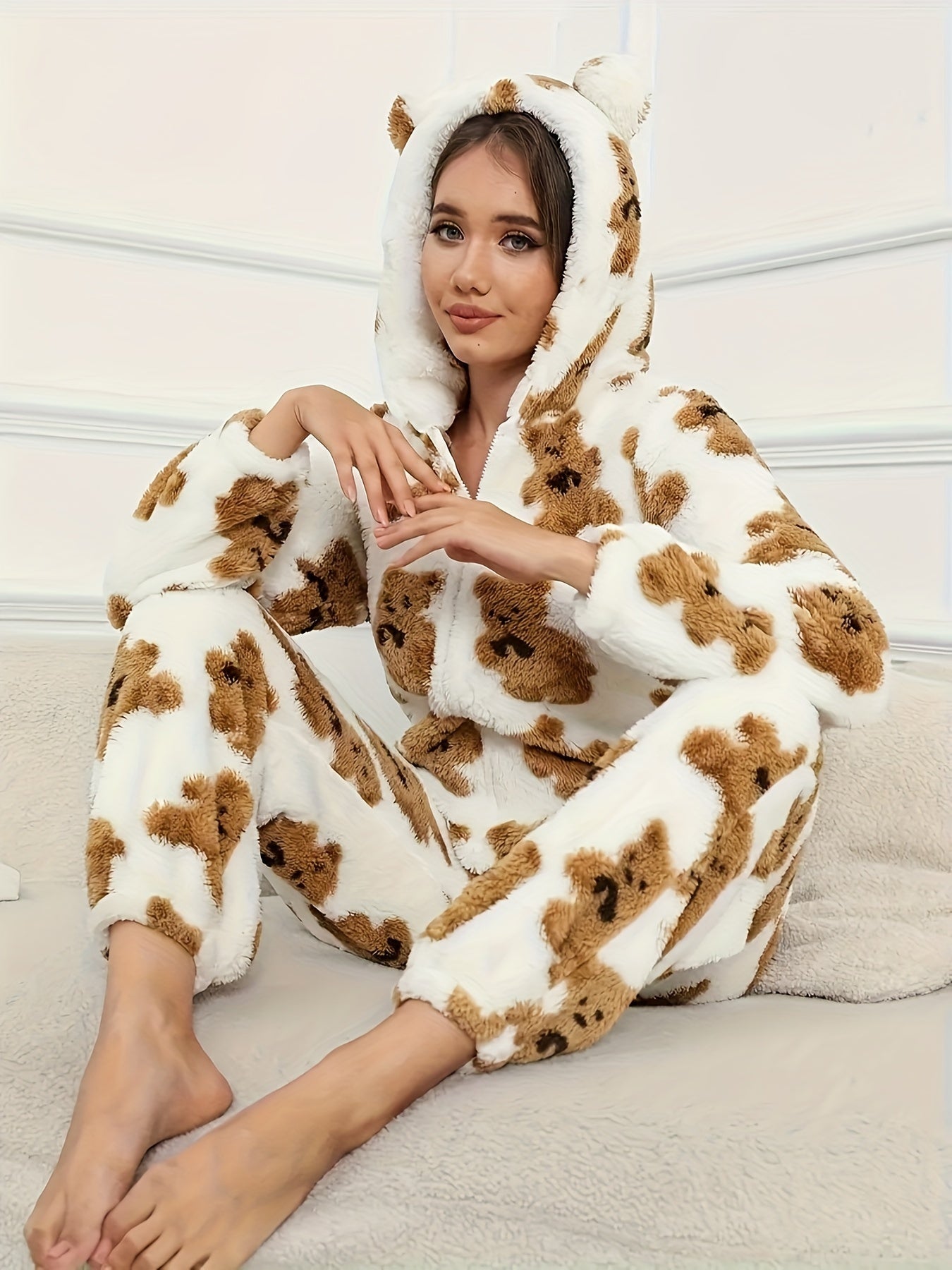 Women's fluffy sleep jumpsuit with zipper, hood, and bear pattern