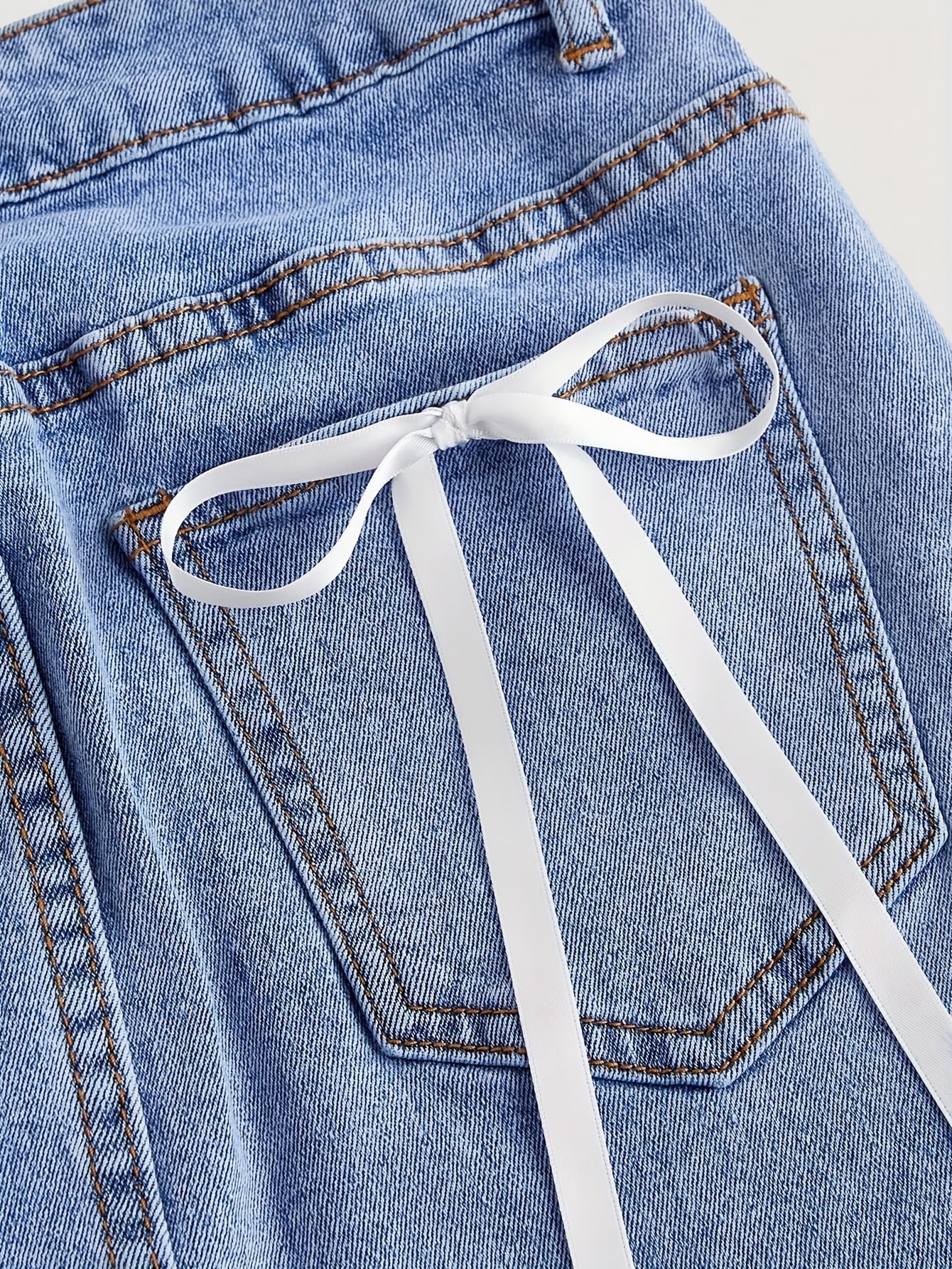Women's denim mini skirt with pockets and bow detail – Elegant casual look
