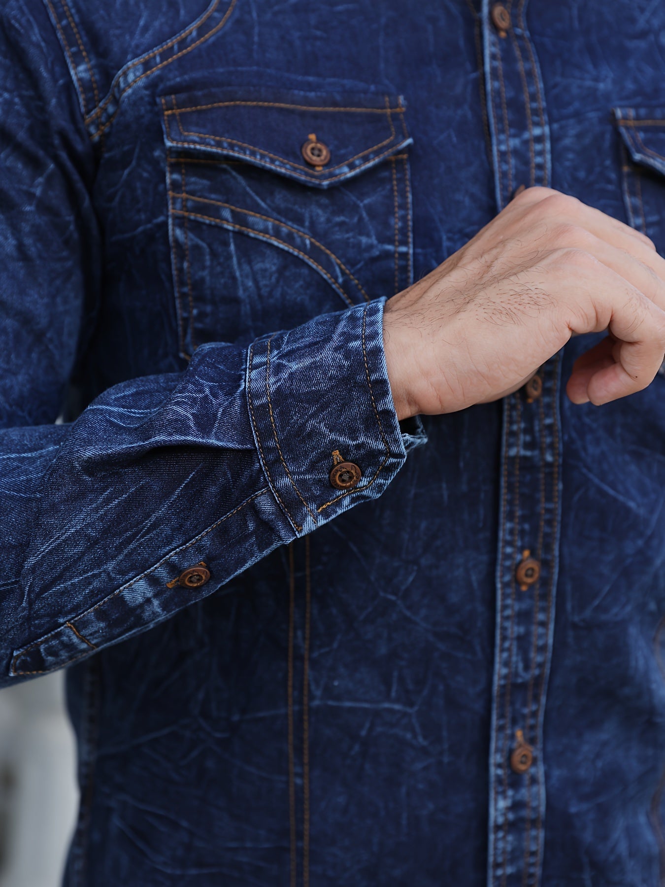 Men's long-sleeve dark blue denim shirt with chest pockets in a worn look