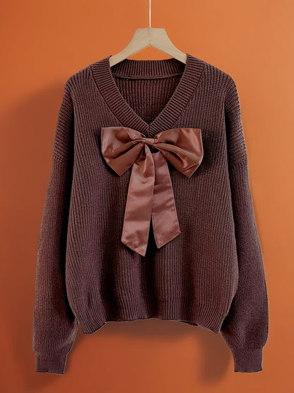 Women's ribbed long-sleeve V-neck sweater with a large bow