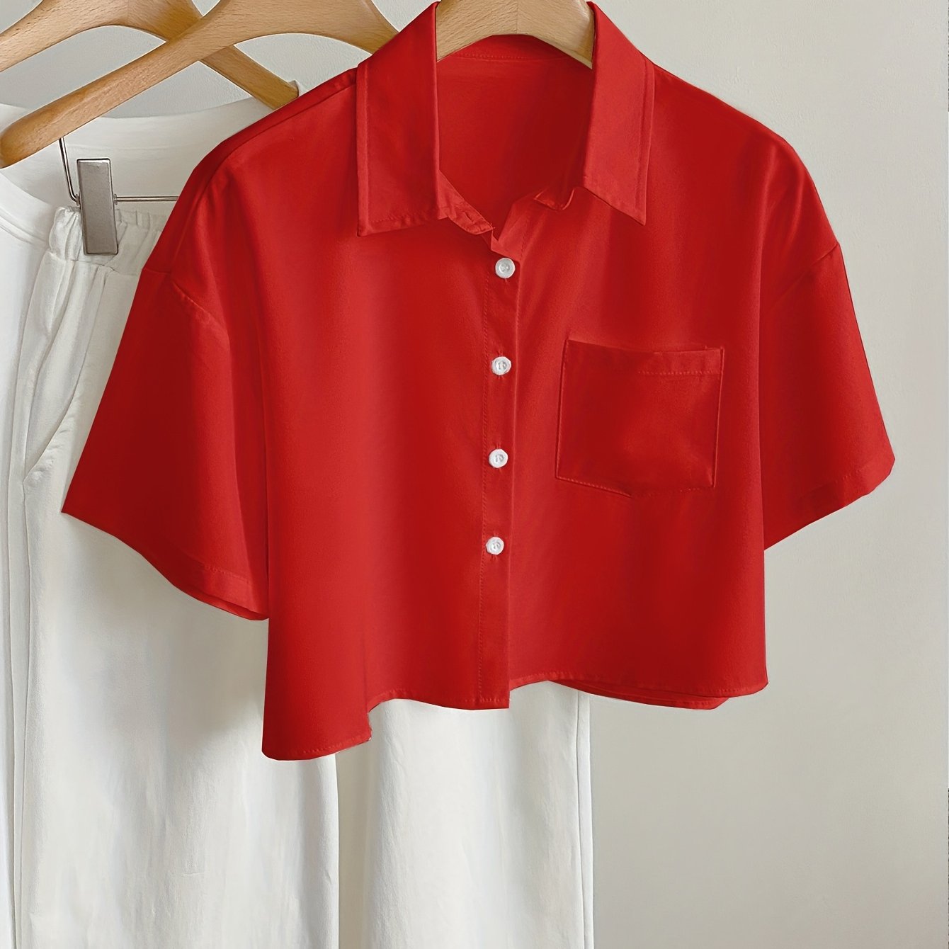 Women's short-sleeve blouse with crop cut and chest pocket – modern casual shirt