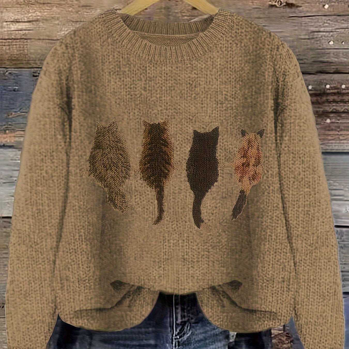 Women's knitted sweater with round neckline and cat motif