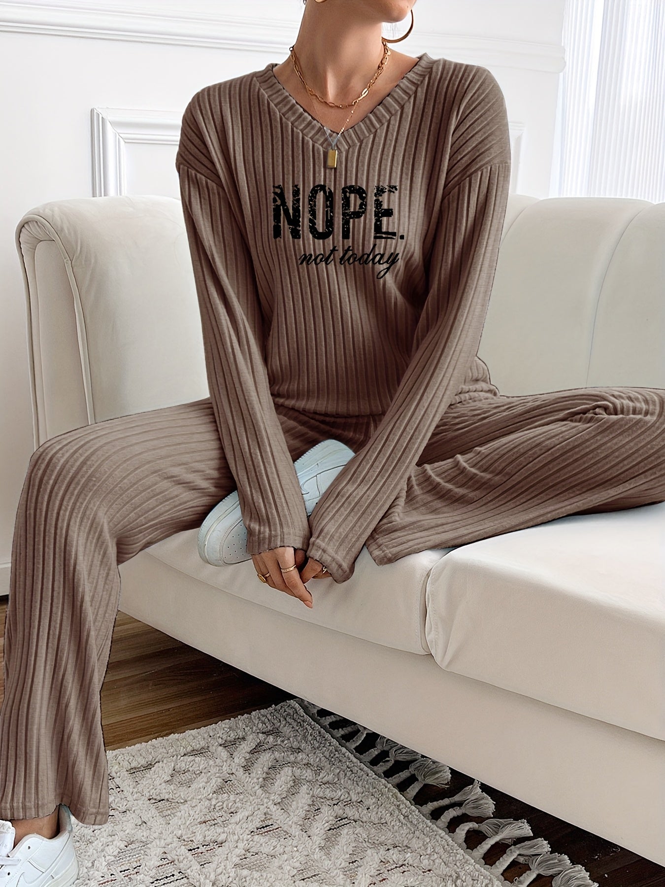 Ribbed women’s two-piece set with a V-neck top featuring lettering and wide-leg pants