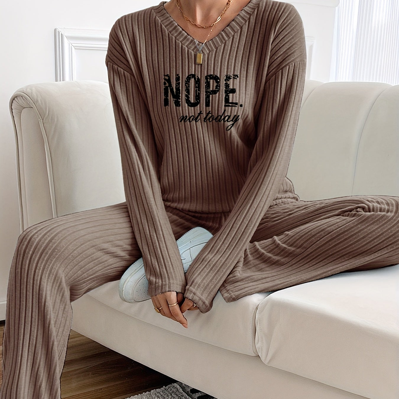 Ribbed women’s two-piece set with a V-neck top featuring lettering and wide-leg pants