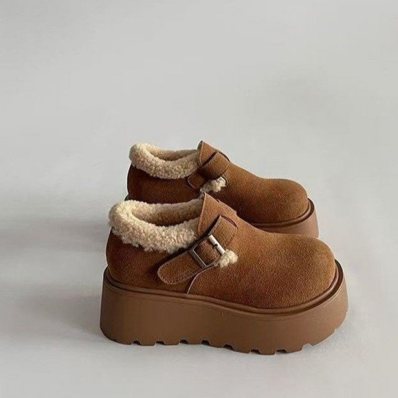 Brown platform moccasins with fur lining and buckle