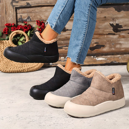 Lined gray ankle boots with quilted uppers and beige plush lining