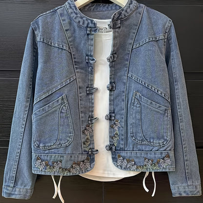 Women's denim jacket with stand-up collar, frog closures, and embroidery