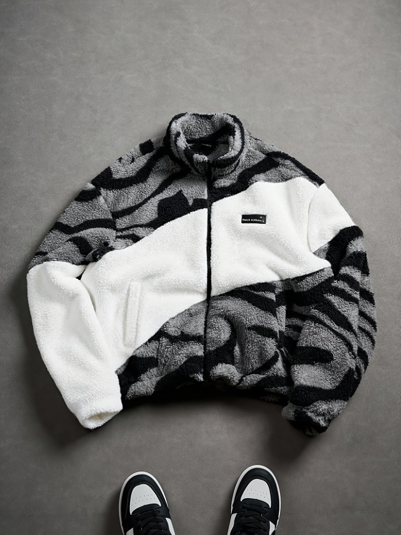 Unisex fleece jacket with stand-up collar, zipper, and animal print