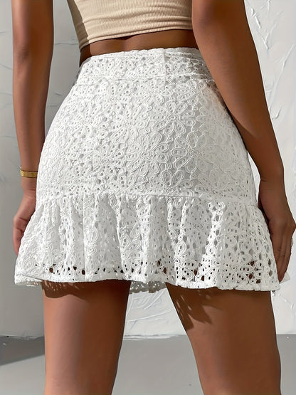 Women's mini skirt in boho style with floral eyelet embroidery and ruffles for summer and leisure