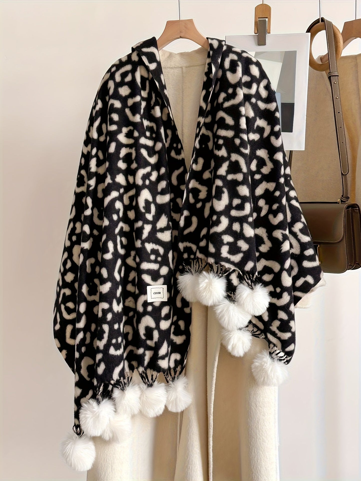Leopard-print scarf with pom-poms