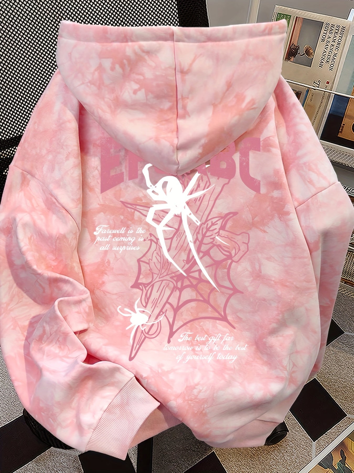 Pink tie-dye hoodie with spider print and hood