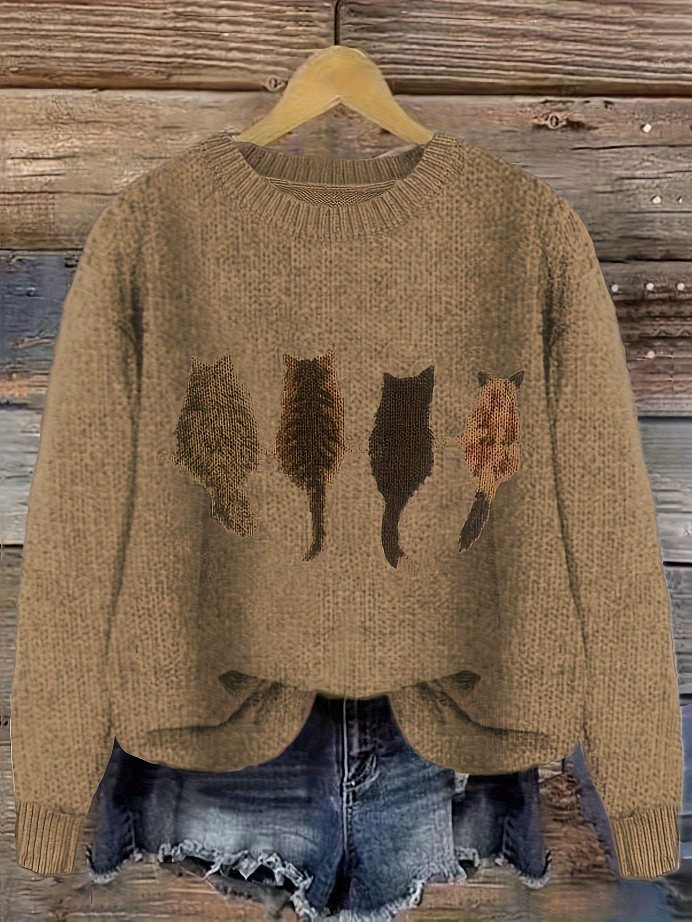 Women's knitted sweater with round neckline and cat motif