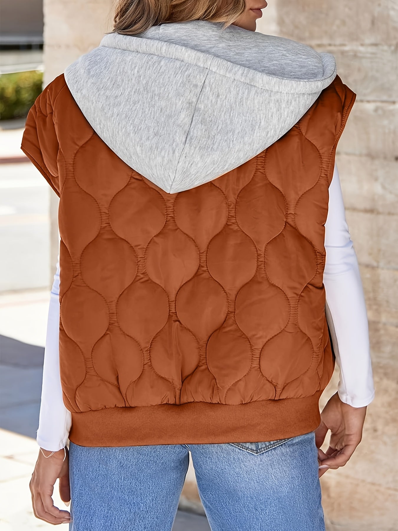 Women's quilted vest with hood in rust brown