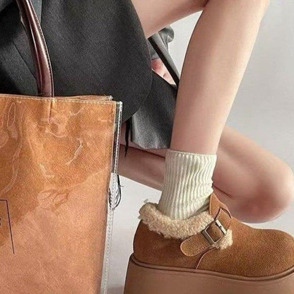 Brown platform moccasins with fur lining and buckle