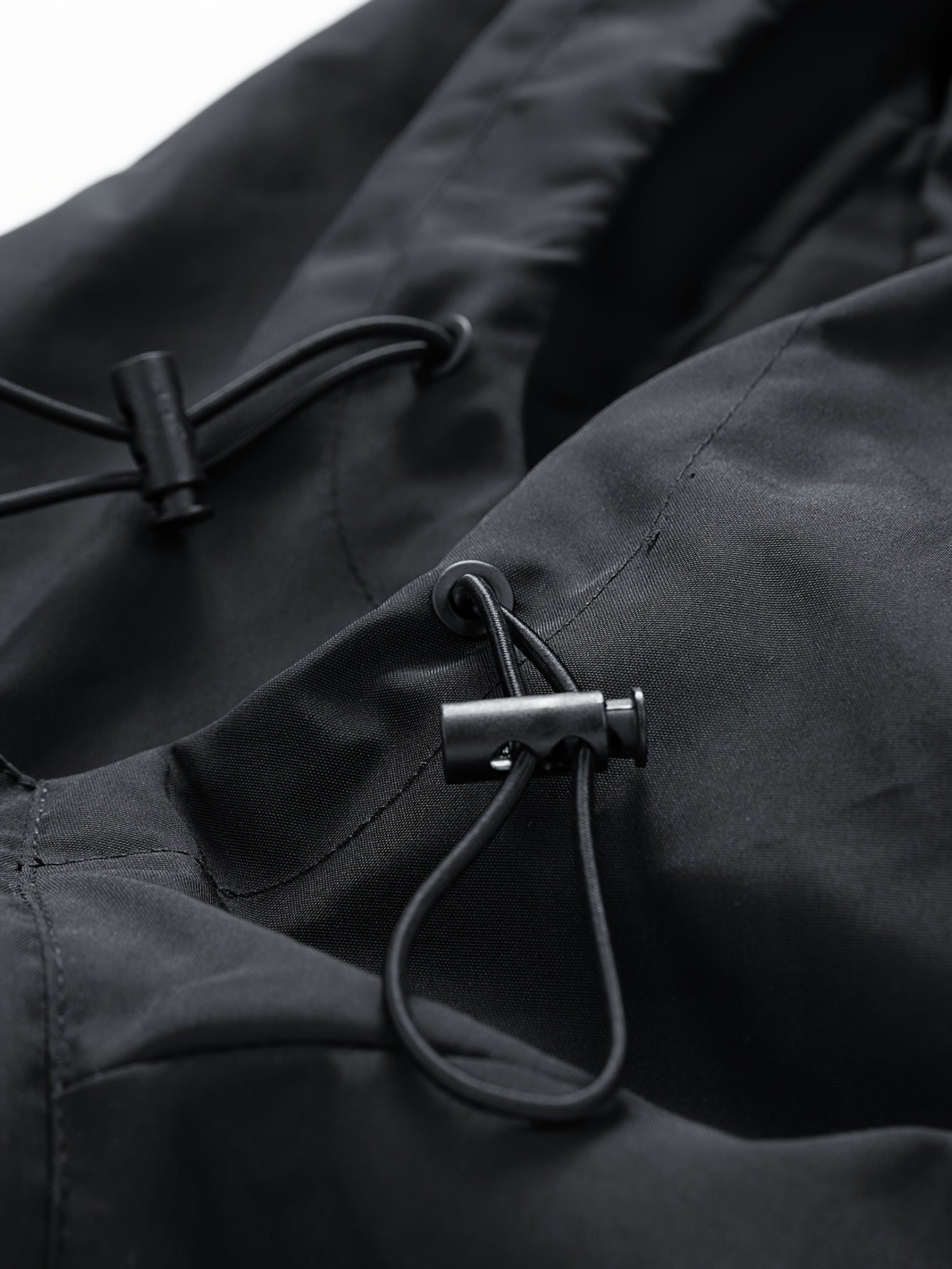 Unisex black windbreaker jacket with hood and red dragon design