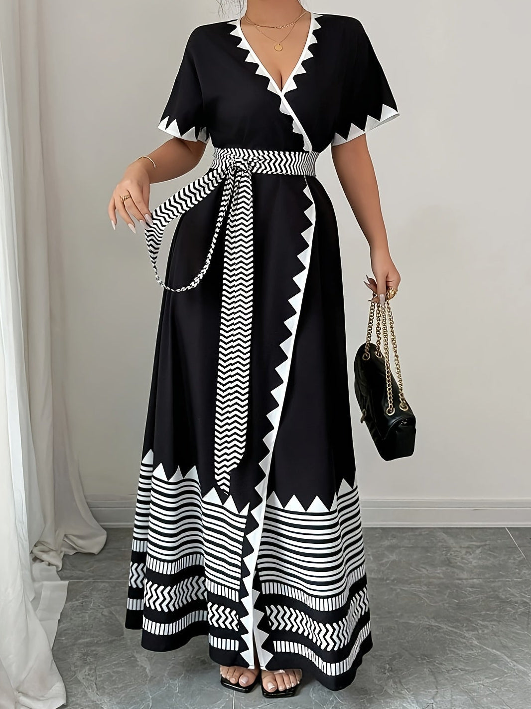 Women's maxi dress with graphic pattern and waist belt – Elegant summer dress for festive occasions