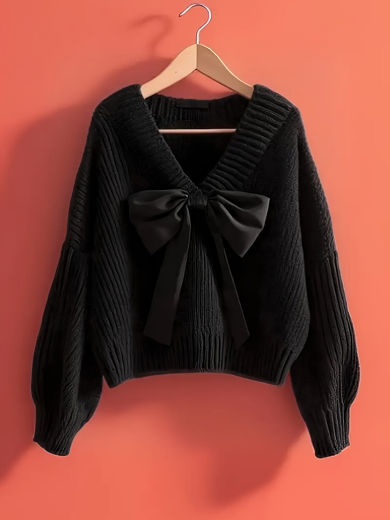Women's ribbed long-sleeve V-neck sweater with a large bow
