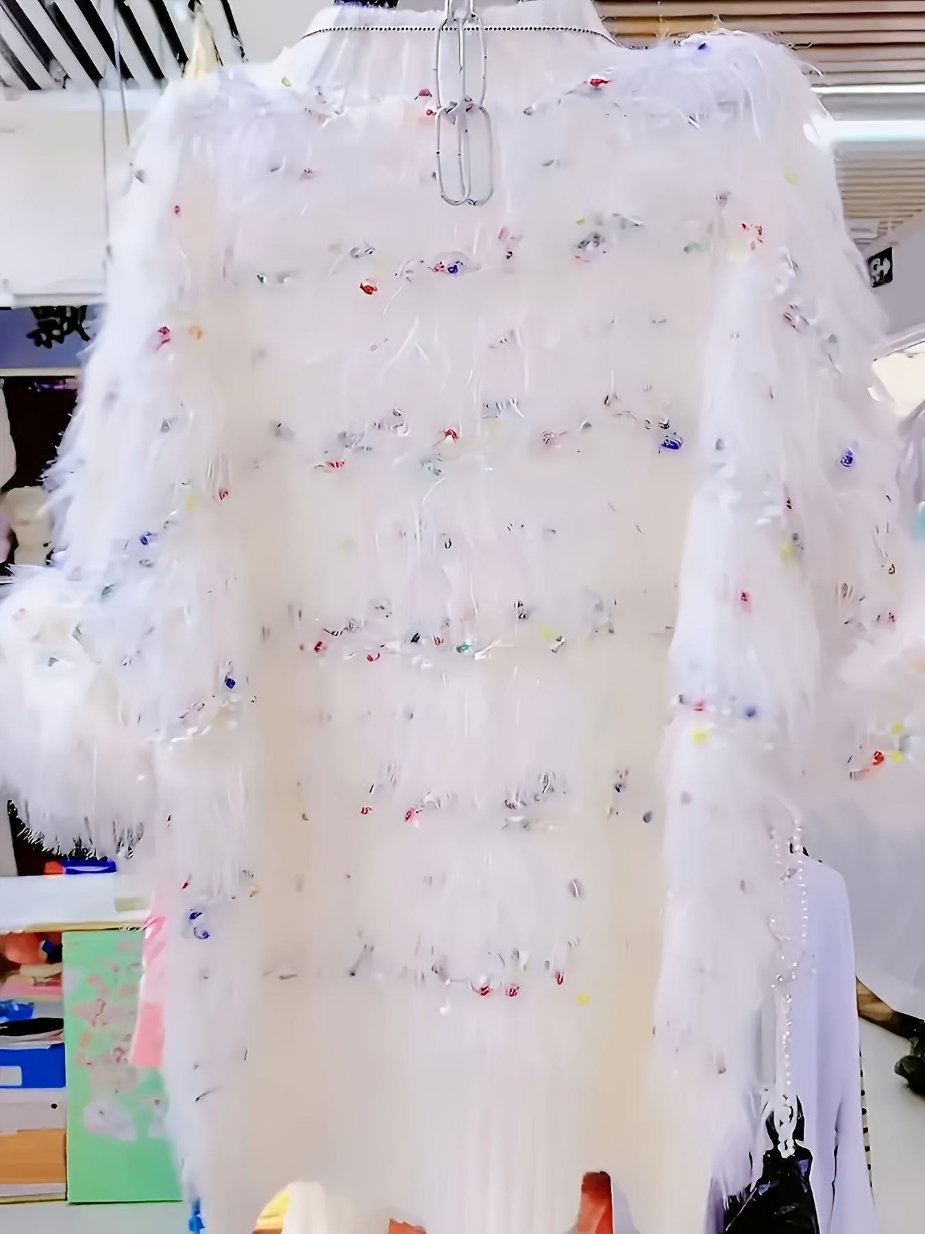 White fluffy pullover with colorful accents