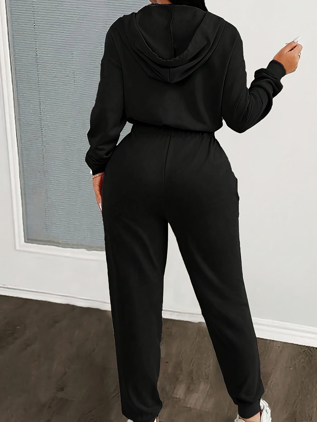 Women's jumpsuit with hood, zipper, and elastic waist