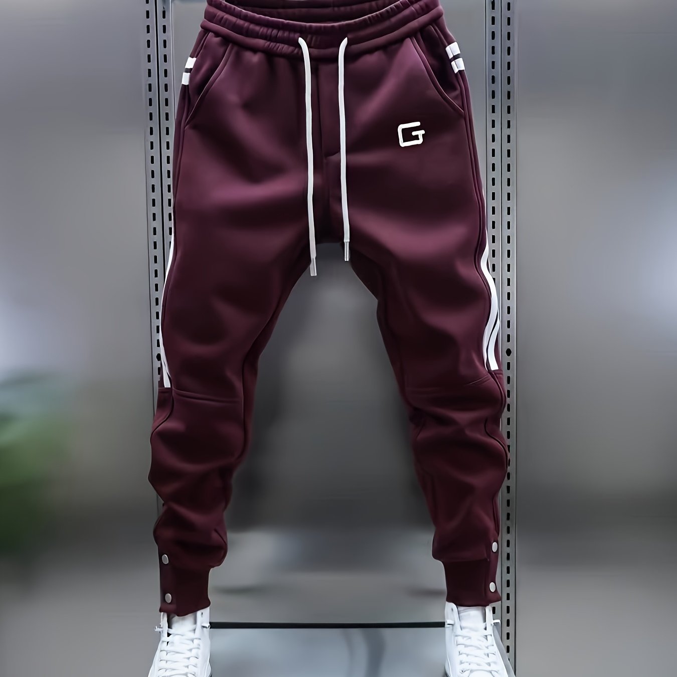 Men's sporty joggers with drawstring, stripes, and buttons
