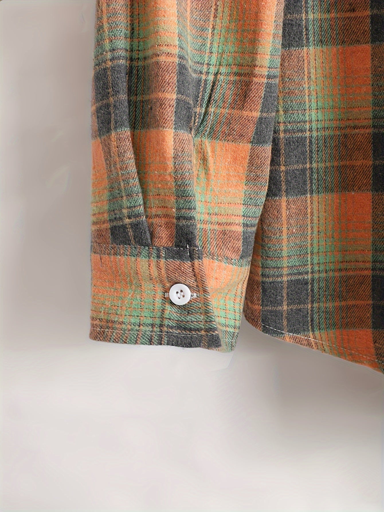 Men's orange and green plaid long-sleeve casual shirt with button placket