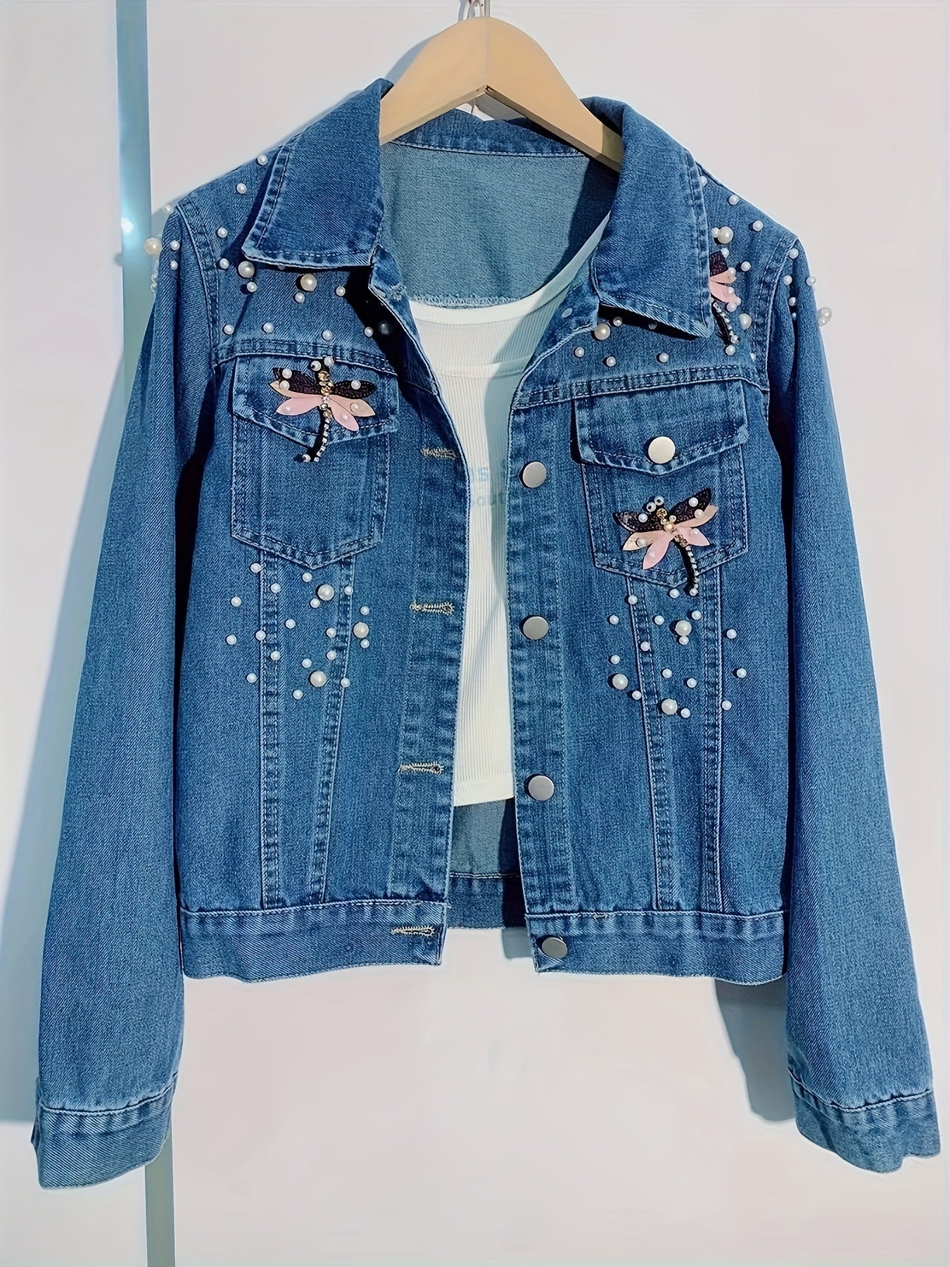 Women's denim jacket with blue pearl embellishments