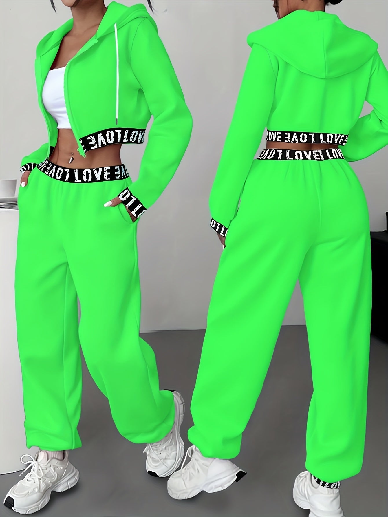 Women's two-piece tracksuit with a hooded jacket and cropped-length joggers featuring a “LOVE” waistband