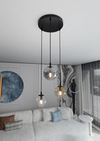 Hanglamp gepoedercoat staal en glas modern Cosmo, zwart met 3 glazen kappen Ø 14 cm, transparant, grafiet en amber
