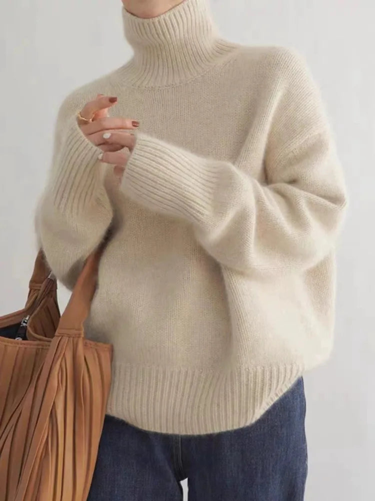 Women's turtleneck sweater in trendy oversized look for autumn and winter, casual and elegant