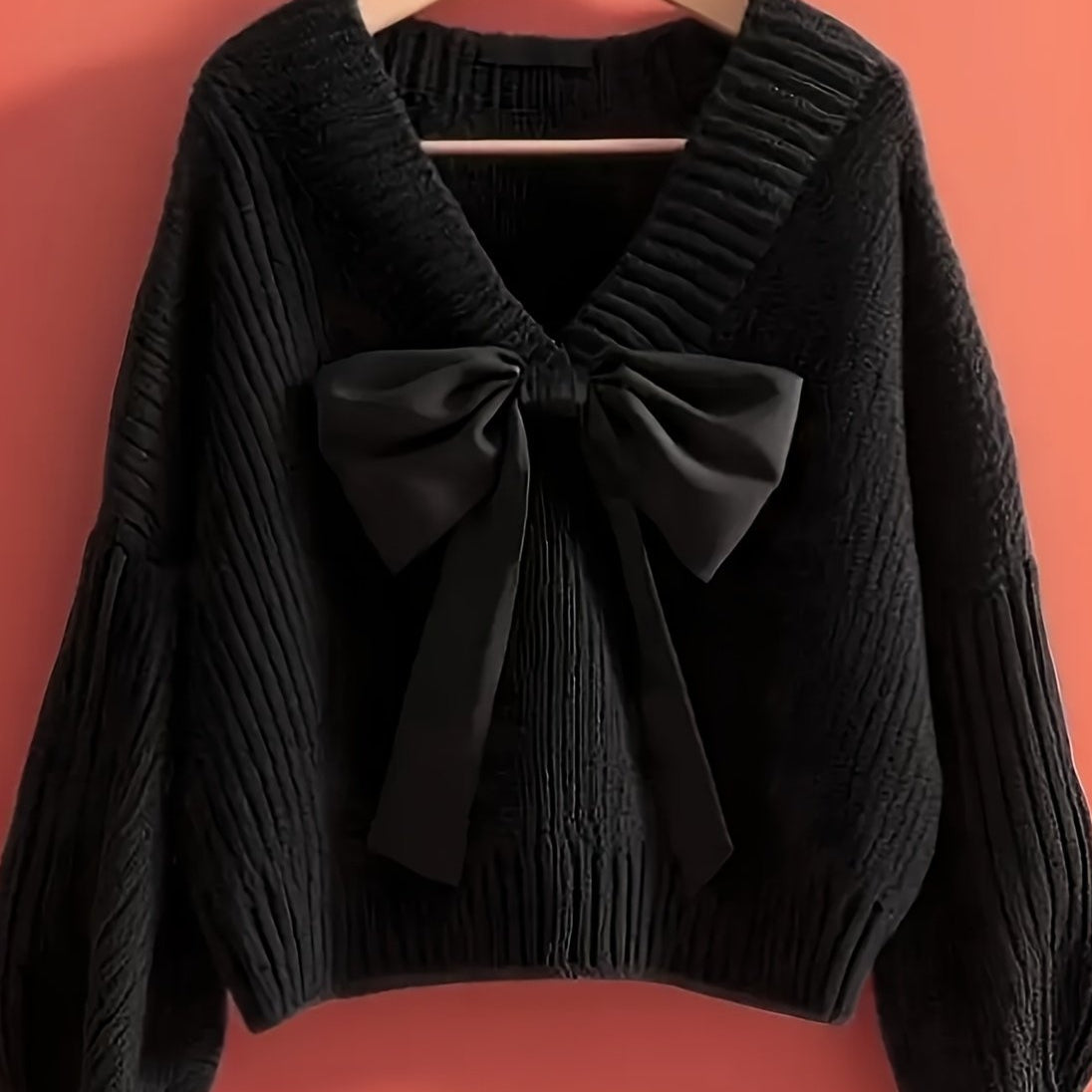 Women's ribbed long-sleeve V-neck sweater with a large bow