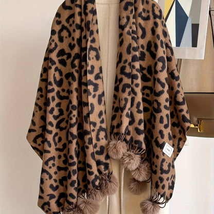 Leopard-print scarf with pom-poms