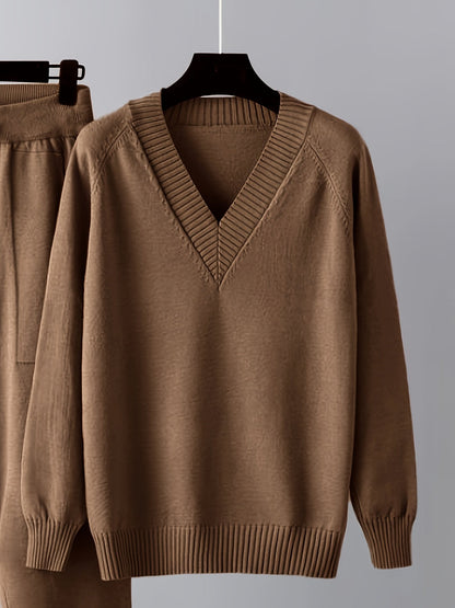 Two-piece women’s knitted set with a V-neck sweater and jogger pants in a beige ribbed-knit design